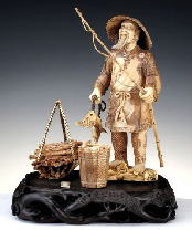 19th century carved ivory figure of a fisherman